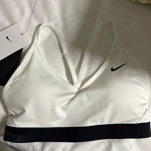 Nike sports bra! Took tag off to try on and it is too small.